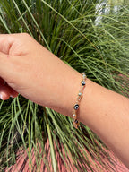 Pulsera ojito negro. Laminado en oro 14k.