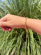 Pulsera estilo torsal. Laminado en oro 14k.