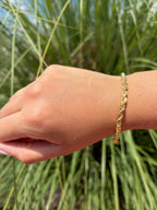 Pulsera estilo torsal. Laminado en oro 14k.
