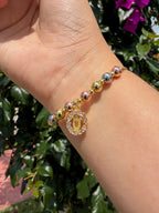 Pulsera virgen. Laminado en oro 14k.
