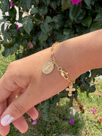 Pulsera virgen con cruz. Laminado en oro 14k.
