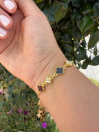 Pulsera trébol negro y brillante. Laminado en oro 14k.