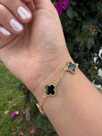 Pulsera trébol negro. Laminado en oro 14k.