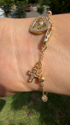 Pulsera 3 colores, virgen corazón + cruz. Laminado en oro 14k