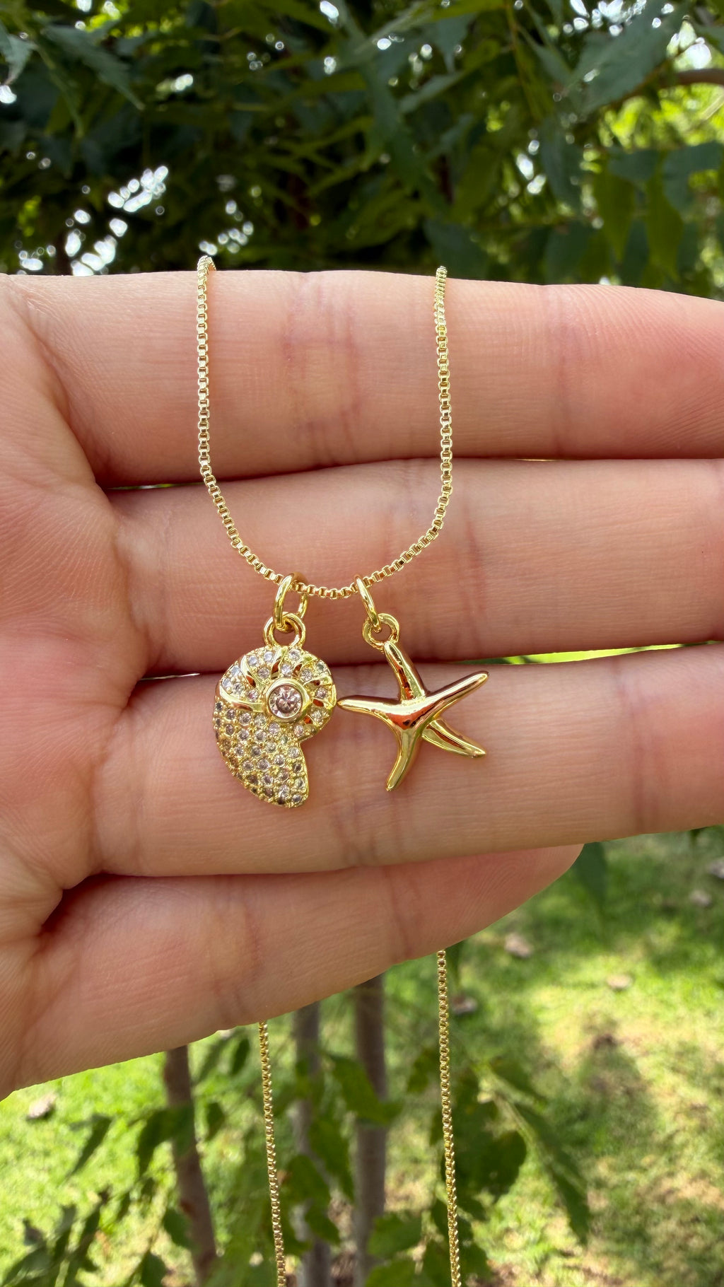 Collar estrella + caracol marino. Laminado en oro 14k