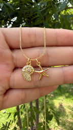 Collar estrella + caracol marino. Laminado en oro 14k