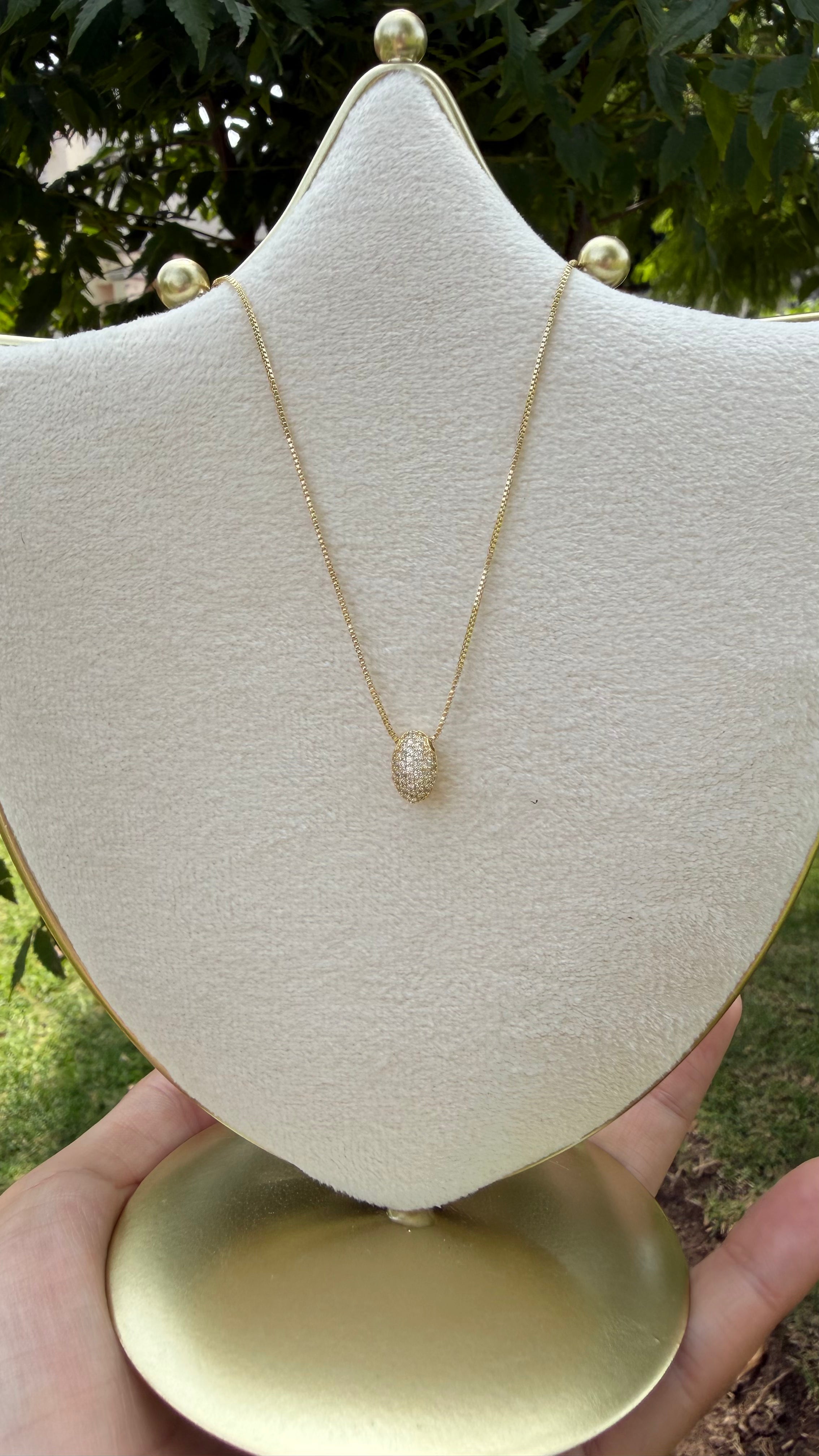 Collar figura brillante. Laminado en oro 14k